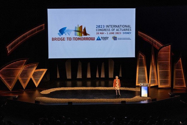 A photo of a speaker on the stage of the Congress