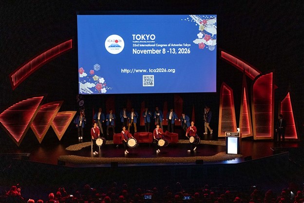 A photo of a musical group on the stage of the Congress